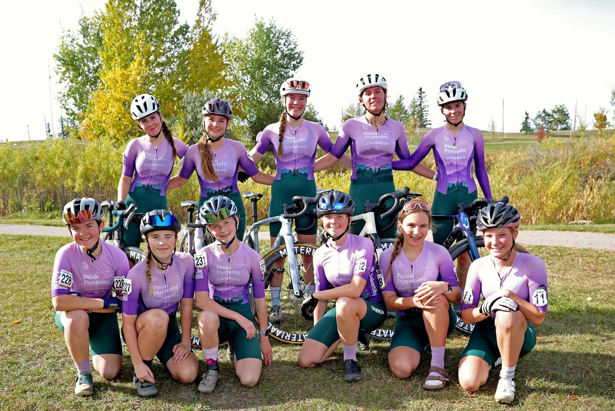 Peak Pursuits riders together with their bikes at a cyclocross race.