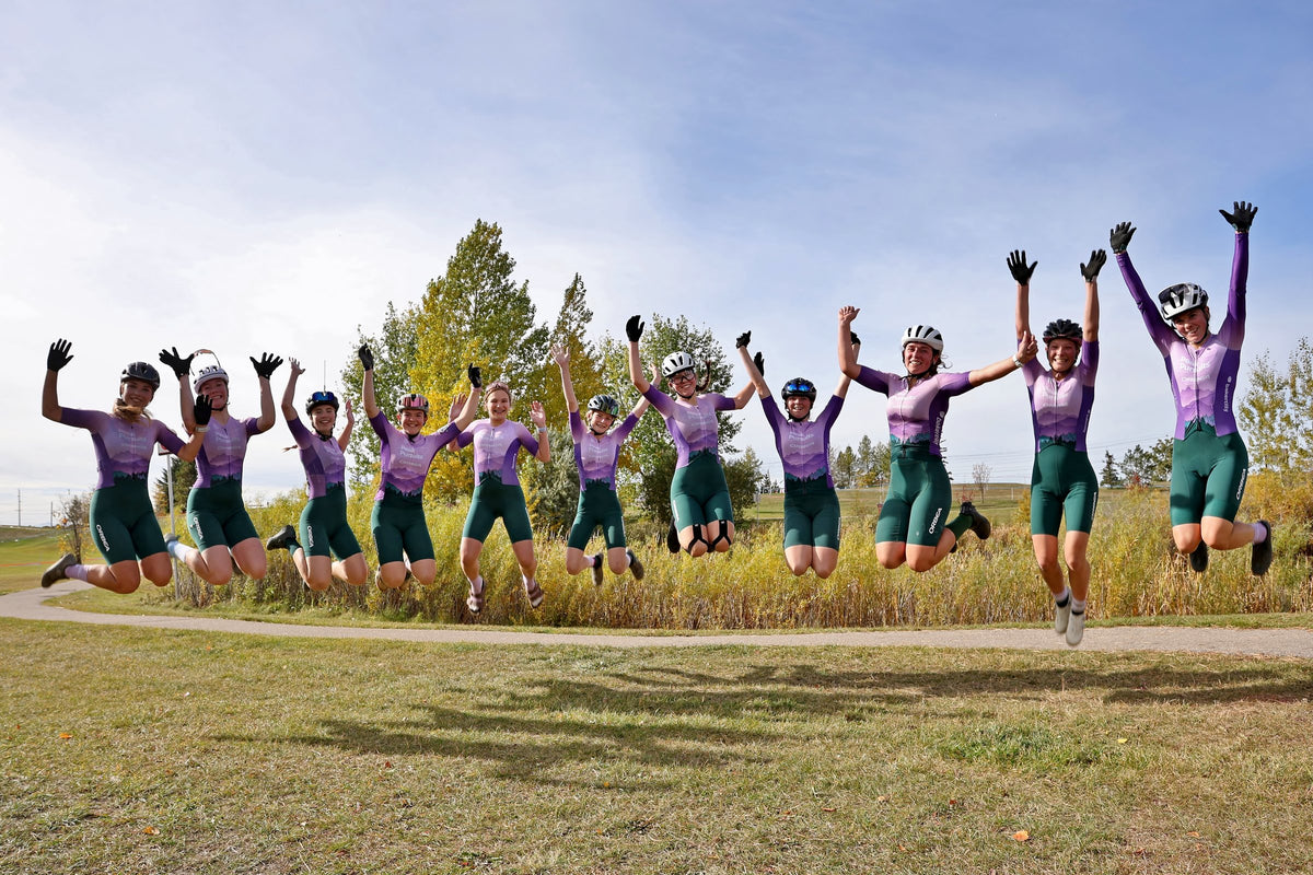 Peak Pursuits teammates celebrating together at the course.